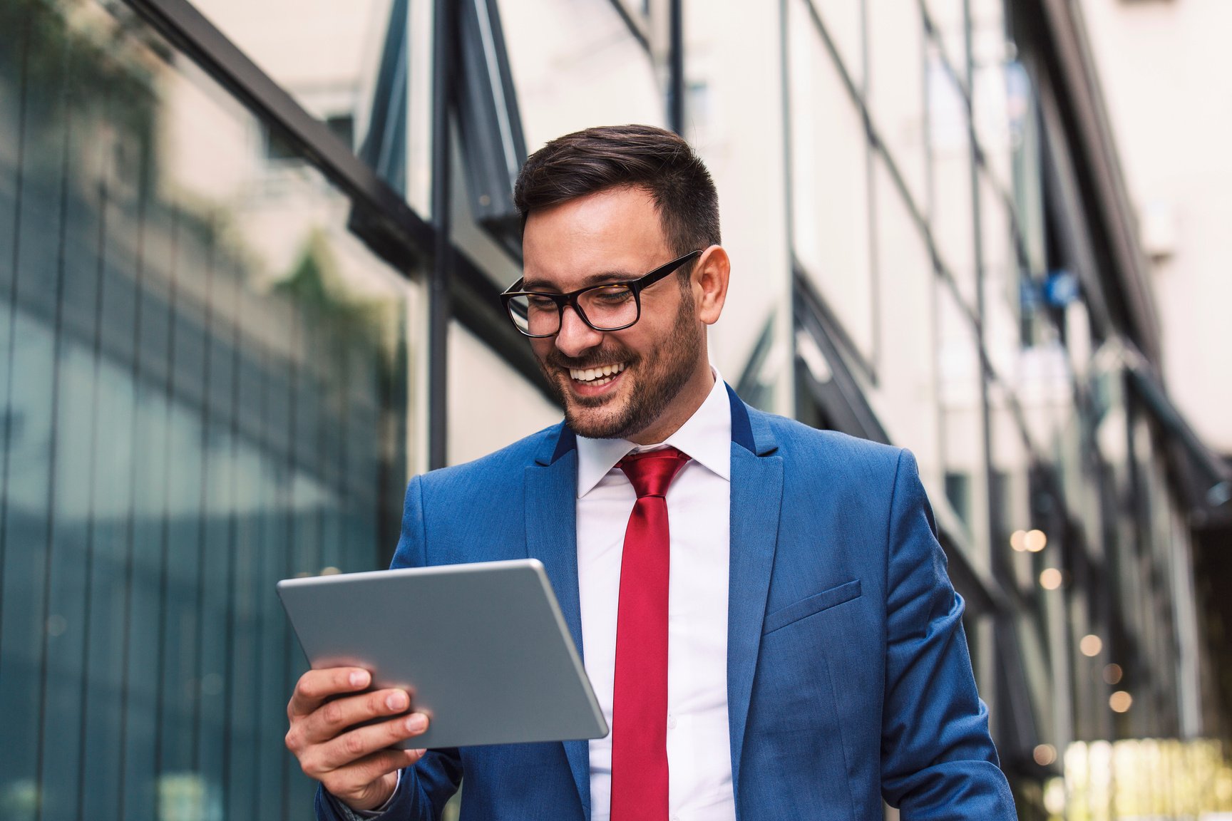 Happy Businessman Using a Tablet